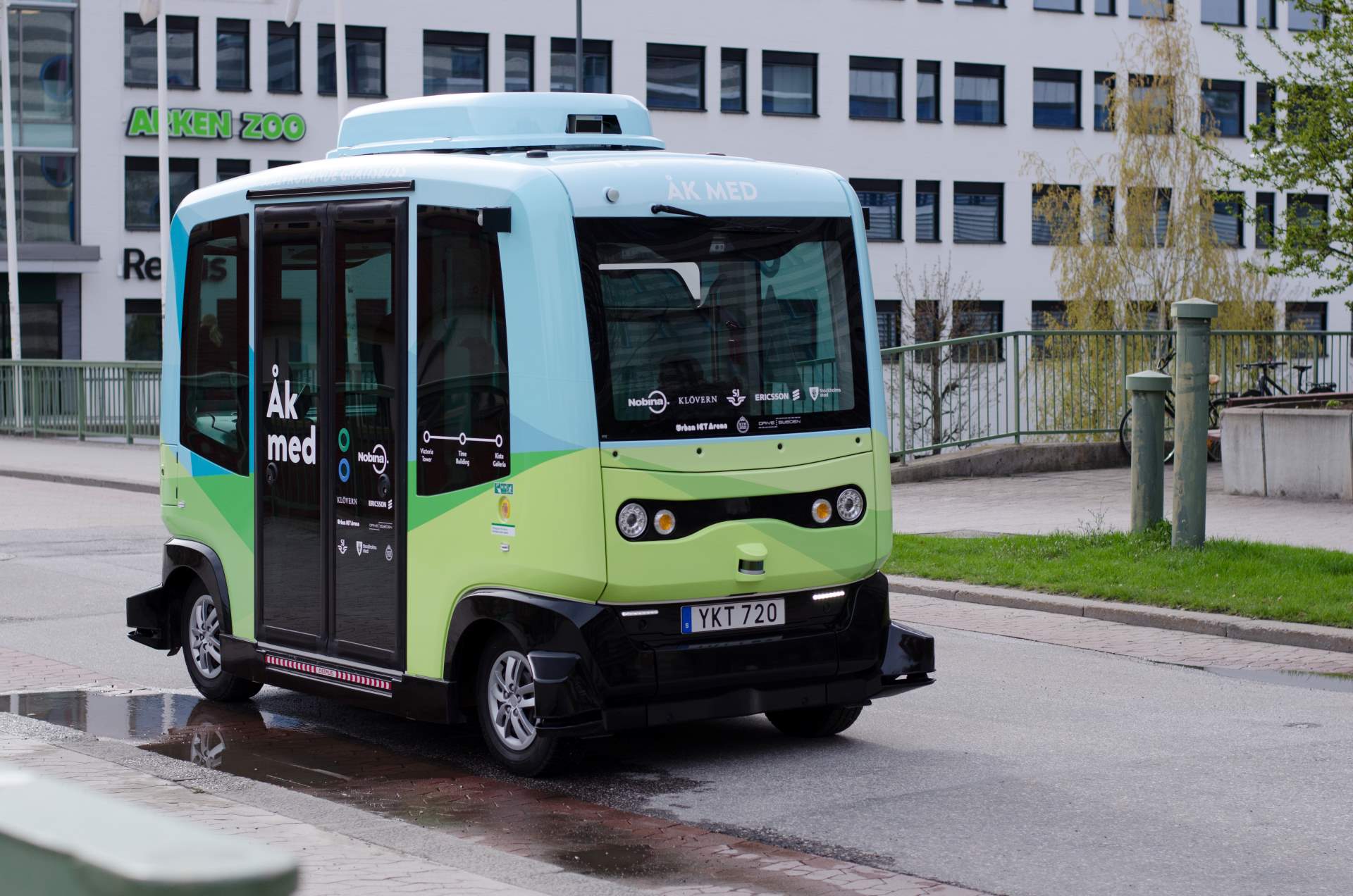 Self-driving minibus drives on the street.